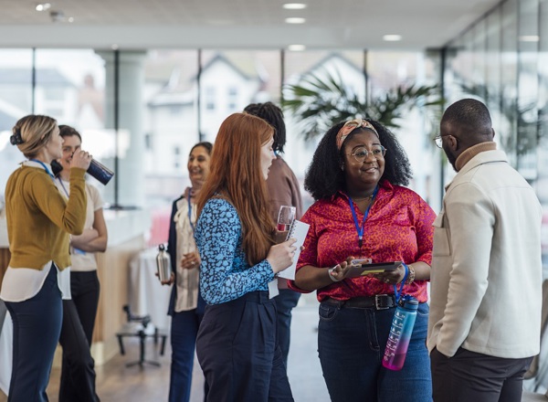 A photo of a group of young delegates at a conference.