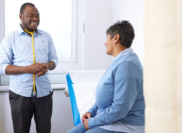 clinical research facility, patient and doctor, consultation, Pan Artists, September 2022,Lalini Carter, Dr Umar Abdullah, Clinical Fellow, ECMT.