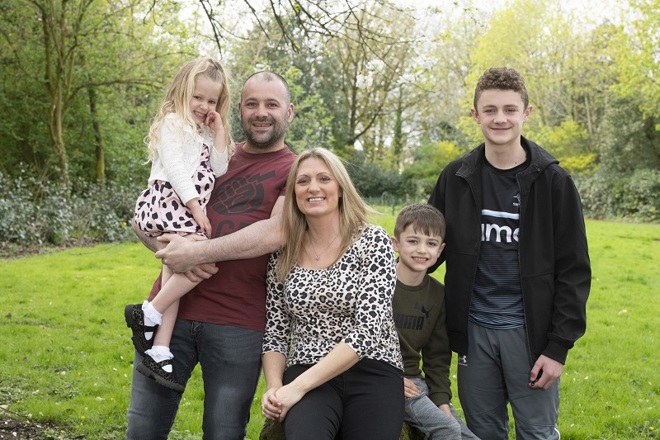 A photo of Christie patient Lyndsey Ainscough, her husband Christian and her children, Perry Spencer and Alfie in a park.