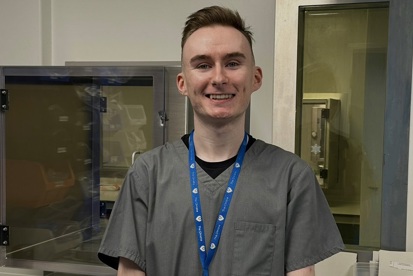 A photo of Fintan Quinn, an aseptic services department apprentice.