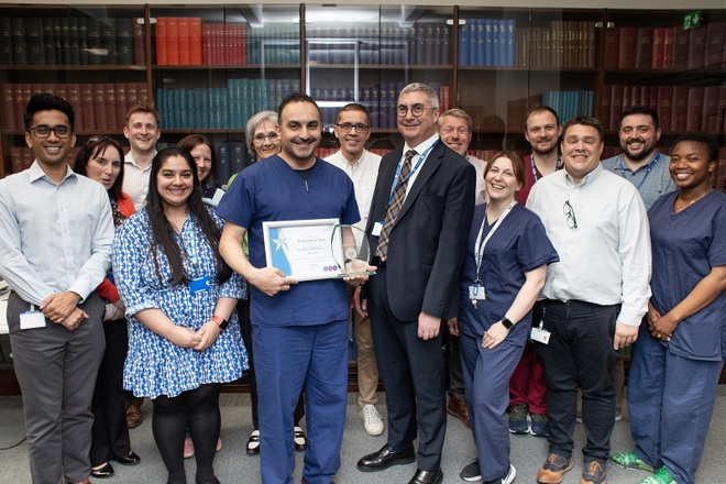 A photo of Dr Mohamed Khalid Abutaleb, his team in General Clinical Oncology and Christie Chief Executive Roger Spencer as the team is presented with their award as the winners of The Christie’s You Made a Difference Award for March 2025.