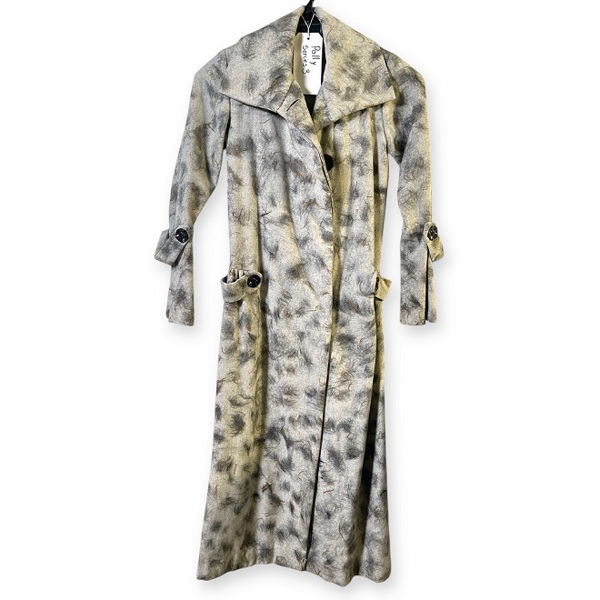 A photo of a tailored coat with abstract stitched patterns.