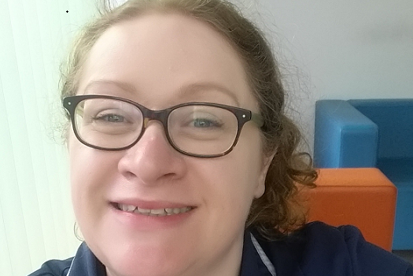 A photo of Fiona Jenkinson, nurse and chaplain at The Christie. She is wearing her nursing uniform and a name badge reading 'Fiona Jenkinson, Sister'.