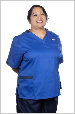 A photo of an enhanced practitioner wearing a uniform in royal blue with navy trim.