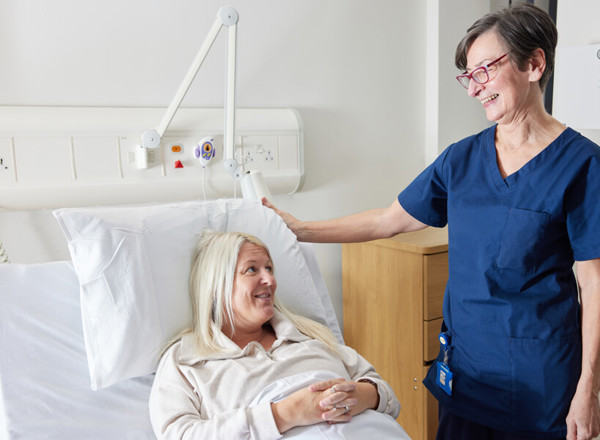 Nurse next to patient in bed, Clinical research facility, CRF manager, Helen Donovan, Pan Artists, Lesley Gray, November 2022
