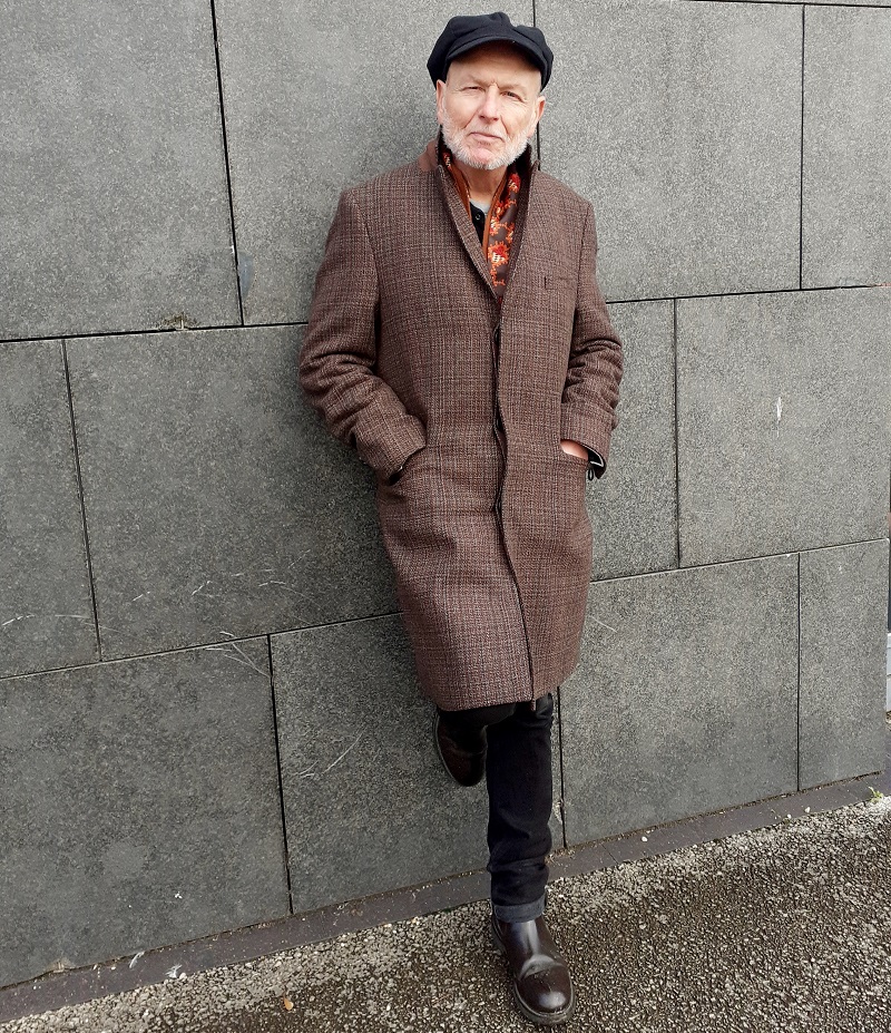 A photo of Graham Caveney, author and journalist from Accrington and Christie patient, leaning against a wall.