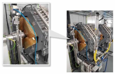 The quadrapole electromagnet used in proton beam therapy, showing that the beam pipe passes through the centre of each quadrapole electromagnet.