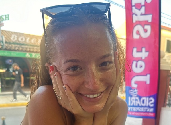 A photo of Christie patient Claudia Laird wearing sunglasses on top of her head.