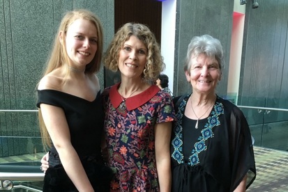 A photo of Christie fundraiser Juliet Hardy-Wilson with her daughter Bea and her mum either side of her.