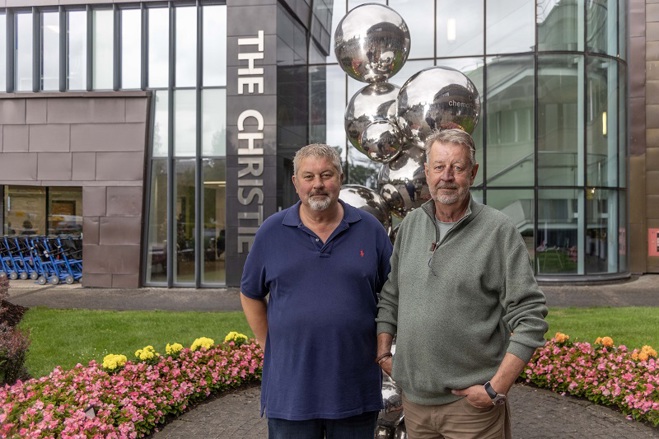 A photo of Christie patients Glenn and Russell Wood outside The Christie.