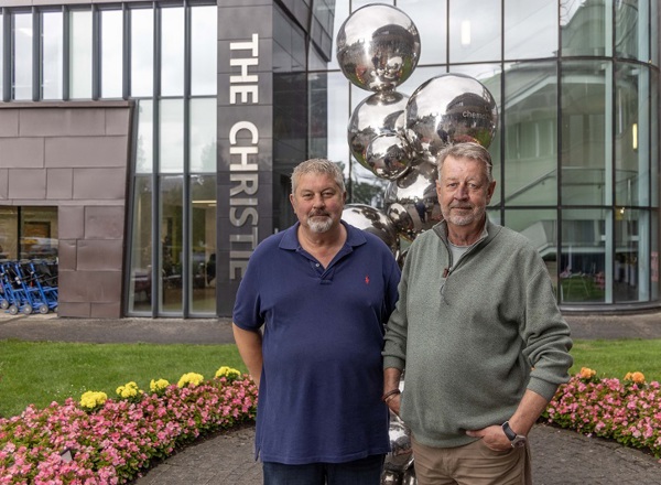 A photo of Christie patients Glenn and Russell Wood outside The Christie.