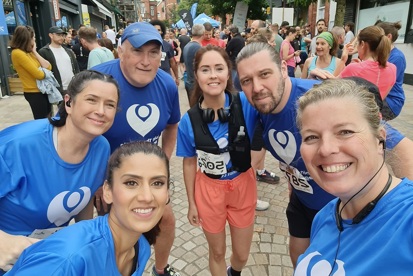 A photo of Christie Charity fundraisers the Blue Light Runners, all wearing blue Christie Charity t-shirts.