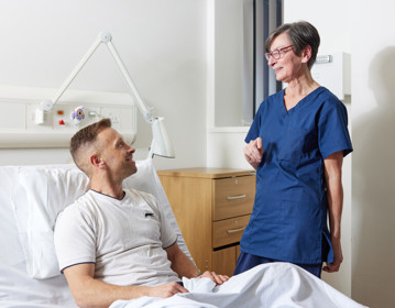 Nurse next to patient in bed, Clinical research facility, CRF manager, Helen Donovan, Pan Artists, Karl Conway, November 2022