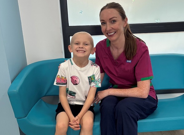 A photo of Christie patient Coby Kings sitting next to Penelope Hart-Spencer, a health play specialist at The Christie