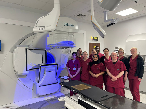 A photo of radiographer staff at The Christie at Salford with the new linear accelerator.