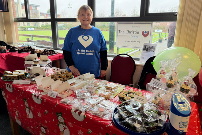 A photo of Christie Charity fundraiser Becky Swift at a charity cake sale.