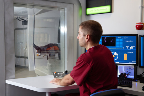 A radiographer in the imagin bay during proton beam therapy, using ProBeam imaging technology to ensure accurate treatment delivery.